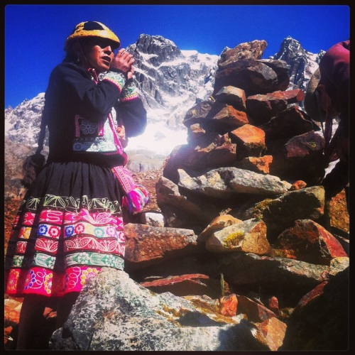 Dona Berna praying at Umantay, holy mountain in the Andes